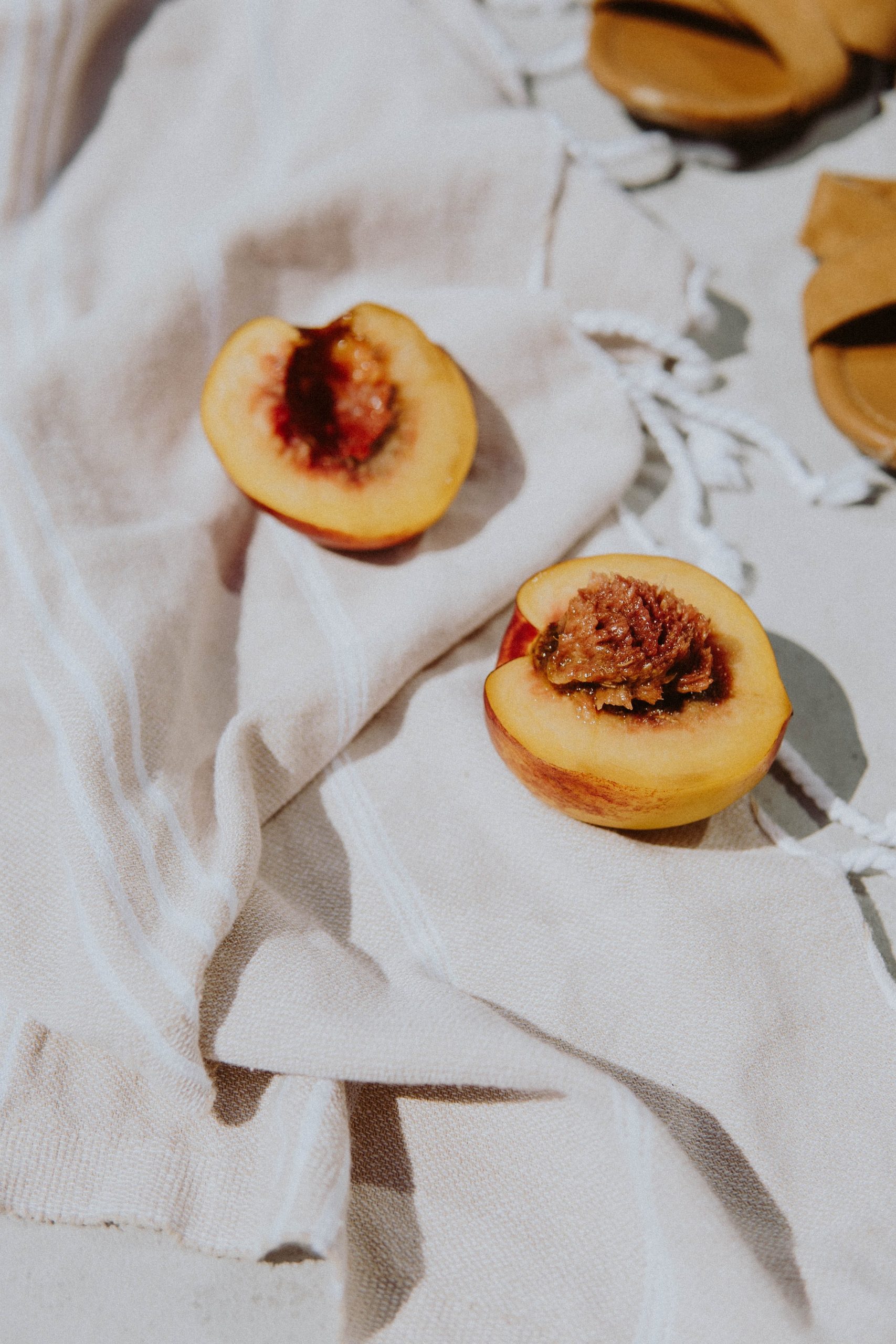 peach halves on a white table cloth